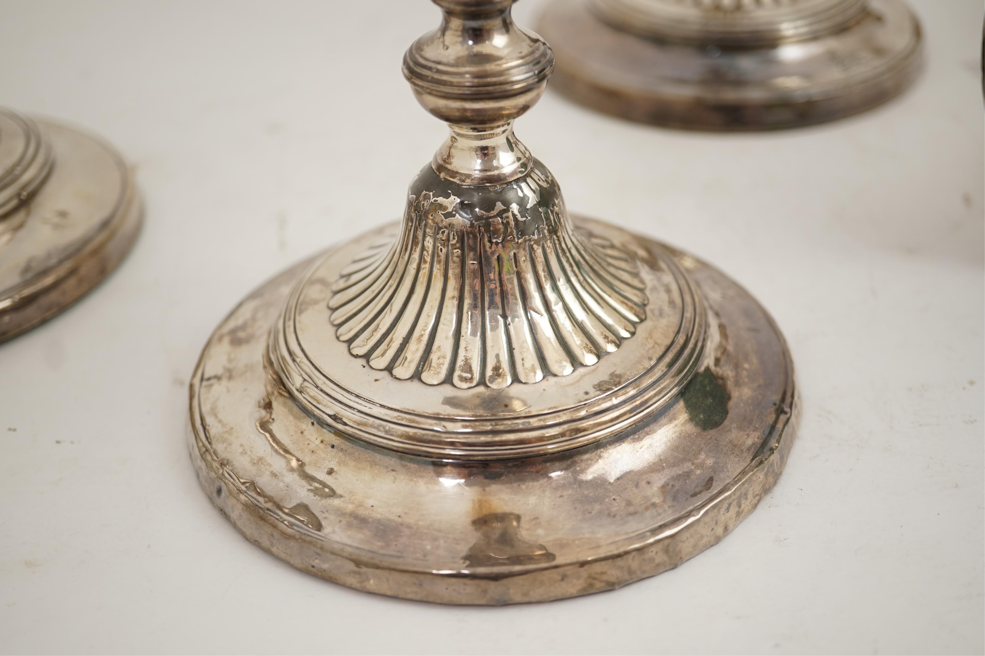A set of four George III silver candlesticks by John Green, Roberts, Mosley & Co